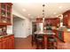 Well-appointed kitchen boasts granite countertops, stainless appliances, and ample cabinet space, adjacent to entry door and closet at 2018 Rosewater Ln, Indian Trail, NC 28079
