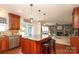 Bright kitchen features granite countertops, stainless steel appliances, and a spacious island with bar stool seating at 2018 Rosewater Ln, Indian Trail, NC 28079