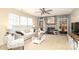 Bright and spacious living room featuring a fireplace, ceiling fan, and ample natural light for a comfortable living experience at 2018 Rosewater Ln, Indian Trail, NC 28079