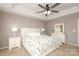Comfortable main bedroom with a ceiling fan, ensuite, and neutral color scheme at 2018 Rosewater Ln, Indian Trail, NC 28079