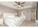 Comfortable main bedroom with a ceiling fan, ensuite, and neutral color scheme at 2018 Rosewater Ln, Indian Trail, NC 28079