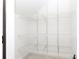 Walk-in pantry with white wire shelving from floor to ceiling offering tons of storage at 2018 Rosewater Ln, Indian Trail, NC 28079