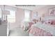 Lovely bedroom featuring two twin beds, soft pink decor, and natural light from windows at 2024 Bramble Hedge Rd # 3275, Indian Trail, NC 28079