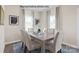 Elegant dining area with a wooden table, chairs, and bright natural light at 2024 Bramble Hedge Rd # 3275, Indian Trail, NC 28079