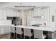 Modern kitchen featuring white cabinets, stainless steel appliances, and a large center island with seating at 2024 Bramble Hedge Rd # 3275, Indian Trail, NC 28079