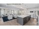 Open-concept kitchen with stainless steel appliances, island, and view of the living room at 2024 Bramble Hedge Rd # 3275, Indian Trail, NC 28079