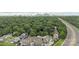 Aerial view of townhomes with a city skyline in the distance and surrounding trees at 2653 Shenandoah Ave, Charlotte, NC 28205
