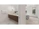 Bright bathroom featuring double sinks with modern fixtures and marble floors at 2653 Shenandoah Ave, Charlotte, NC 28205