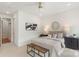 Bedroom features a round mirror, ceiling fan, and two side tables with lamps at 2653 Shenandoah Ave, Charlotte, NC 28205