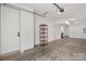 Spacious garage with high ceilings, ample storage and shelving, providing a secure and organized parking area at 2653 Shenandoah Ave, Charlotte, NC 28205