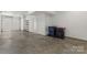 Clean and spacious garage with concrete floor, offering ample room for parking and storage solutions at 2653 Shenandoah Ave, Charlotte, NC 28205