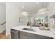 Open kitchen with stainless steel appliances, white countertops and access to dining and living spaces at 2653 Shenandoah Ave, Charlotte, NC 28205