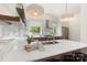 Bright kitchen with quartz countertops, stainless steel appliances, wood accents and backyard view at 2653 Shenandoah Ave, Charlotte, NC 28205