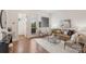 Sunlit living room featuring modern furniture, hardwood floors, and access to a balcony at 2653 Shenandoah Ave, Charlotte, NC 28205