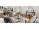 Open-concept living room with hardwood floors, contemporary furnishings, and a view of the kitchen at 2653 Shenandoah Ave, Charlotte, NC 28205