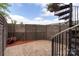 Cozy private patio features brick pavers, a charming spiral staircase, and a decorative wooden fence for added privacy at 2653 Shenandoah Ave, Charlotte, NC 28205