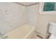 This bathroom shows tiled wall to ceiling and tiled floor, and contains a tub and window at 2701 Ravencroft Dr, Charlotte, NC 28208