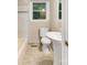 This bathroom shows tiled floor, toilet, and sink at 2701 Ravencroft Dr, Charlotte, NC 28208