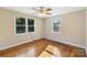 Inviting bedroom with hardwood floors and natural light streaming through the windows at 2701 Ravencroft Dr, Charlotte, NC 28208
