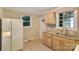 Functional kitchen with tiled flooring, wooden cabinets, and granite countertops at 2701 Ravencroft Dr, Charlotte, NC 28208