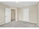 Clean, empty bedroom with neutral carpet and paint at 2840 Hopeton Ct, Monroe, NC 28110