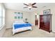Well-lit bedroom with ceiling fan and en-suite bathroom access at 2840 Hopeton Ct, Monroe, NC 28110
