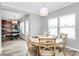 Welcoming dining area with wood floors and a round table next to the open kitchen at 2840 Hopeton Ct, Monroe, NC 28110
