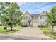 Inviting two-story townhouse with a well-maintained lawn, teal door and blue shutters at 2840 Hopeton Ct, Monroe, NC 28110