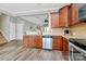 Open kitchen featuring wood cabinetry, granite counters, and a stainless steel dishwasher at 2840 Hopeton Ct, Monroe, NC 28110
