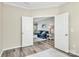 Cozy living room entrance with open double doors and wood floors and a blue sofa at 2840 Hopeton Ct, Monroe, NC 28110