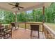 Relax on this back porch that has views of a lush backyard at 3011 Waxhaw Crossing Dr, Waxhaw, NC 28173