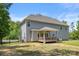 Expansive backyard with a covered patio and wooden deck, perfect for outdoor relaxation at 3011 Waxhaw Crossing Dr, Waxhaw, NC 28173