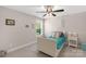 Charming bedroom with plush carpets, natural lighting, and colorful decorations at 3011 Waxhaw Crossing Dr, Waxhaw, NC 28173