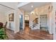 Inviting foyer with hardwood floors, staircase and views into other rooms at 3011 Waxhaw Crossing Dr, Waxhaw, NC 28173