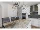 Bright kitchen features white cabinets, stainless steel appliances, granite countertops, and center island with seating at 3011 Waxhaw Crossing Dr, Waxhaw, NC 28173