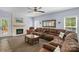 Spacious living room with stone fireplace, large sectional couch, and plenty of room for entertaining at 3011 Waxhaw Crossing Dr, Waxhaw, NC 28173