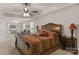 Spacious main bedroom boasts tray ceiling, ceiling fan, and sitting area with lots of natural light at 3011 Waxhaw Crossing Dr, Waxhaw, NC 28173