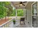 Cozy covered front porch offers a seating area with a view of the landscaped yard at 3011 Waxhaw Crossing Dr, Waxhaw, NC 28173