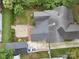 A birds-eye view of a home with a well-maintained roof, driveway, and landscaped yard with mature trees at 308 W Monroe St, Salisbury, NC 28144