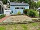 Backyard with gravel landscaping, trees, and shrubs, offering a tranquil outdoor space at 308 W Monroe St, Salisbury, NC 28144