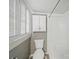 Functional bathroom showcasing a toilet, shower, and natural light at 308 W Monroe St, Salisbury, NC 28144