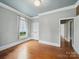 Comfortable bedroom featuring hardwood floors, neutral paint, and a bright window at 308 W Monroe St, Salisbury, NC 28144
