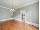 Dining room with hardwood floors and vintage lighting fixture at 308 W Monroe St, Salisbury, NC 28144