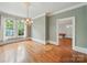Dining room with hardwood floors and vintage lighting fixture near kitchen at 308 W Monroe St, Salisbury, NC 28144