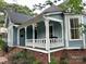 Inviting home with a charming covered porch and brick foundation at 308 W Monroe St, Salisbury, NC 28144