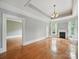 Spacious living room featuring hardwood floors, fireplace and large windows at 308 W Monroe St, Salisbury, NC 28144