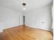 Spacious living room with hardwood floors, neutral walls, and a closet at 308 W Monroe St, Salisbury, NC 28144