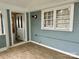 Screened porch with bead board and painted blue with a view of the interior of the home through an open door at 308 W Monroe St, Salisbury, NC 28144