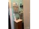 Cozy bathroom featuring a vanity with storage and horizontally paneled teal walls at 325 N Caldwell Ave, Newton, NC 28658