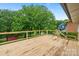 Spacious wooden deck overlooking a lush backyard, great for gatherings at 3326 Winterfield Pl, Charlotte, NC 28205
